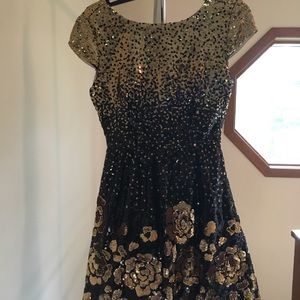 Black and gold sequin dress